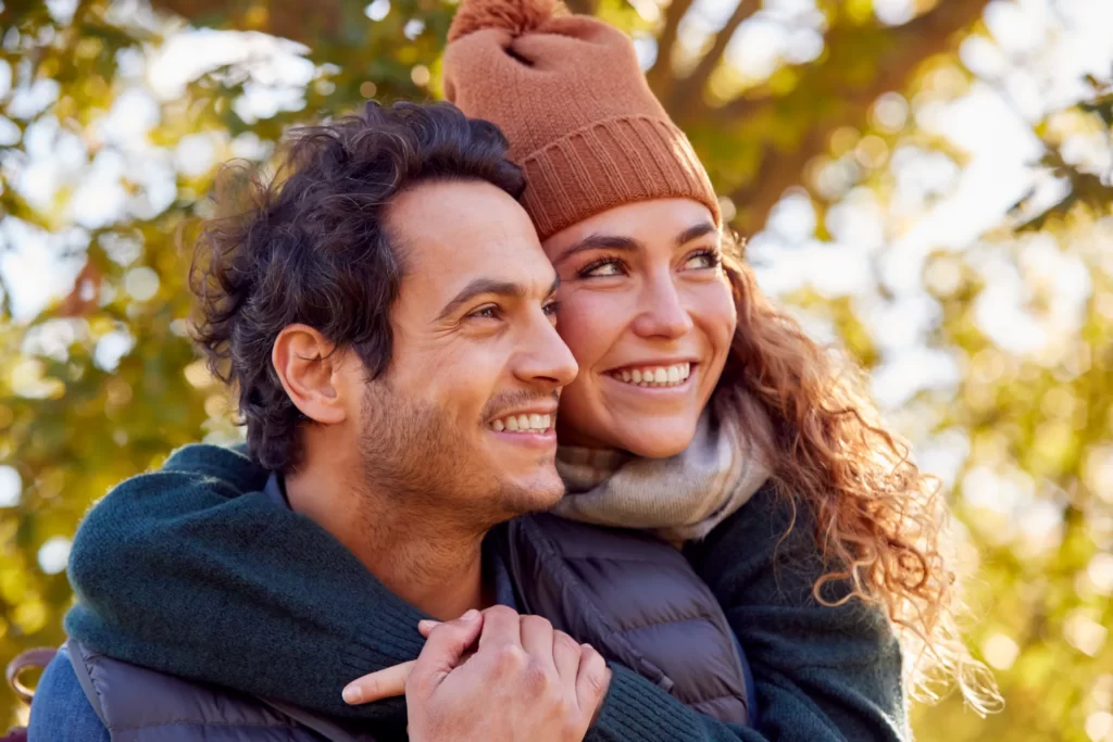 happy loving couple meeting and hugging in autumn utc